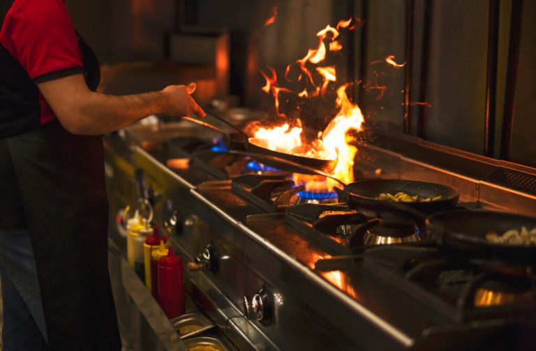 Chef flaming food at a restaurant